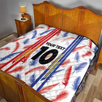 White quilt blanket with red and blue leaf stripes, “YOUR TEXT”, and large number 10