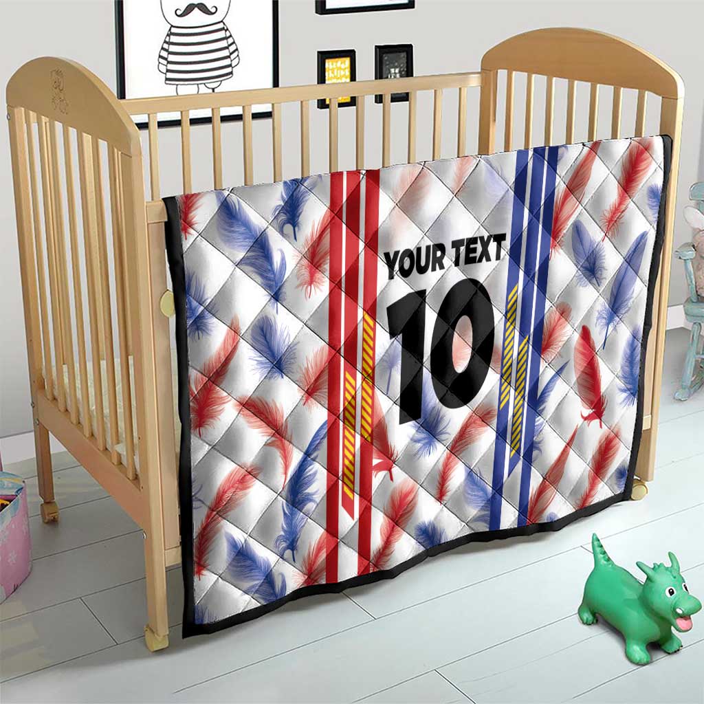 White quilt blanket for crib with red and blue leaf stripes, “YOUR TEXT”, and number 10
