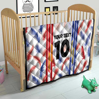 White quilt blanket for crib with red and blue leaf stripes, “YOUR TEXT”, and number 10
