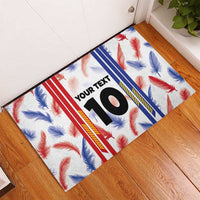 Custom rubber doormat with white feather pattern, bold number 10 and blue red stripe accents