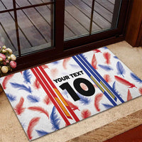 Custom rubber doormat on entry floor, white feather print with number 10 center panel
