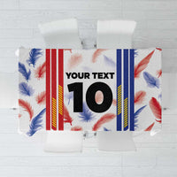 Custom football jersey tablecloth close-up: “YOUR TEXT” and “10” on feather-print background.
