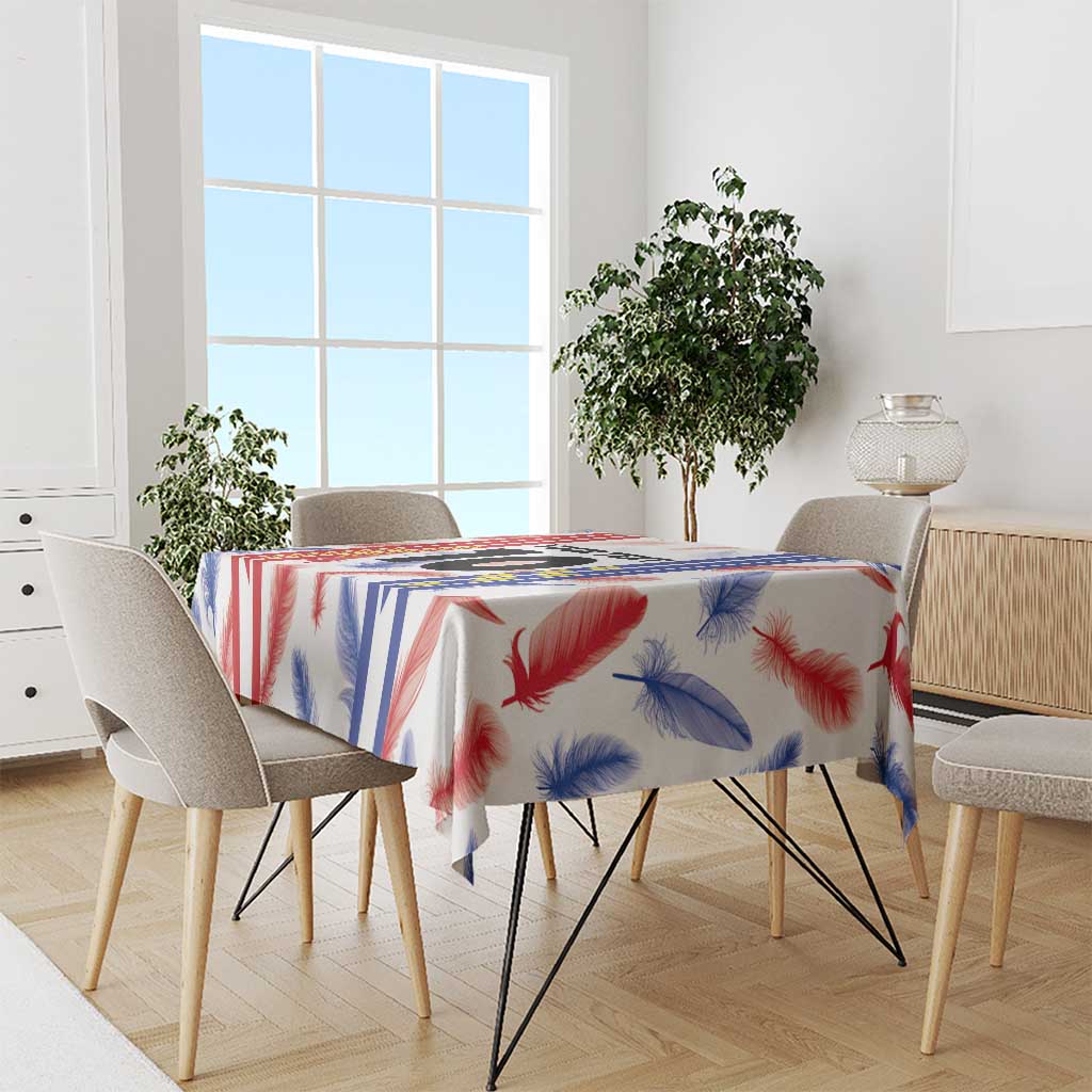 Custom football jersey tablecloth draped on dining table with feather and stripe pattern.