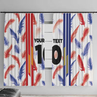 Two window curtain panels with feather print stripes and oversized black “10”