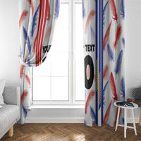 Window curtain panels with red, blue, and white feather pattern and bold black “10”