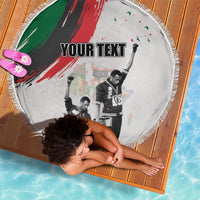 Round beach blanket with fringe edge, portrait graphic, 'YOUR TEXT' and red/green stripe
