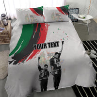 White duvet and pillow shams with red-green brush design, black-and-white figures, “YOUR TEXT”
