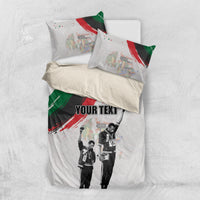 White bedding set viewed from above with “YOUR TEXT,” black-and-white figures, red/green artwork