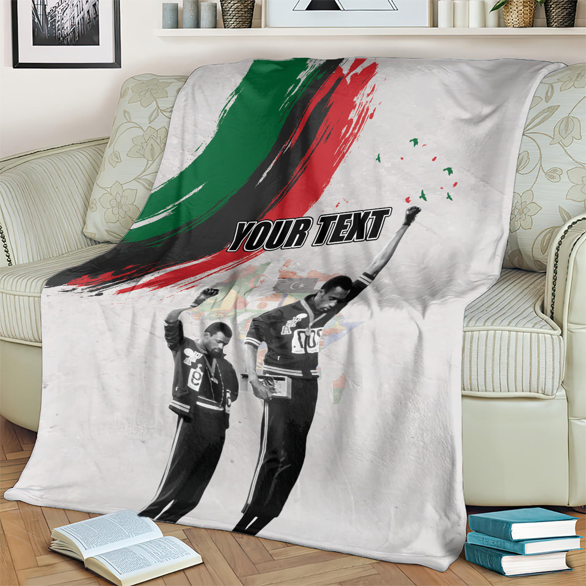 Light gray personalized blanket on bed with green-red brush stripe and black-and-white figures