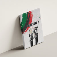 Personalized canvas wall art tilted on a wall with “YOUR TEXT” and two raised-fist figures