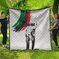 White personalized quilt: black-and-white figures with green/red brushstroke and 'YOUR TEXT'