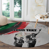 Round gray rug with 'YOUR TEXT' over black-and-white freedom-day salutes and brush marks
