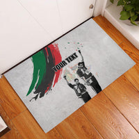 Gray rubber doormat with black edge and green-red brush salute print, 'YOUR TEXT'