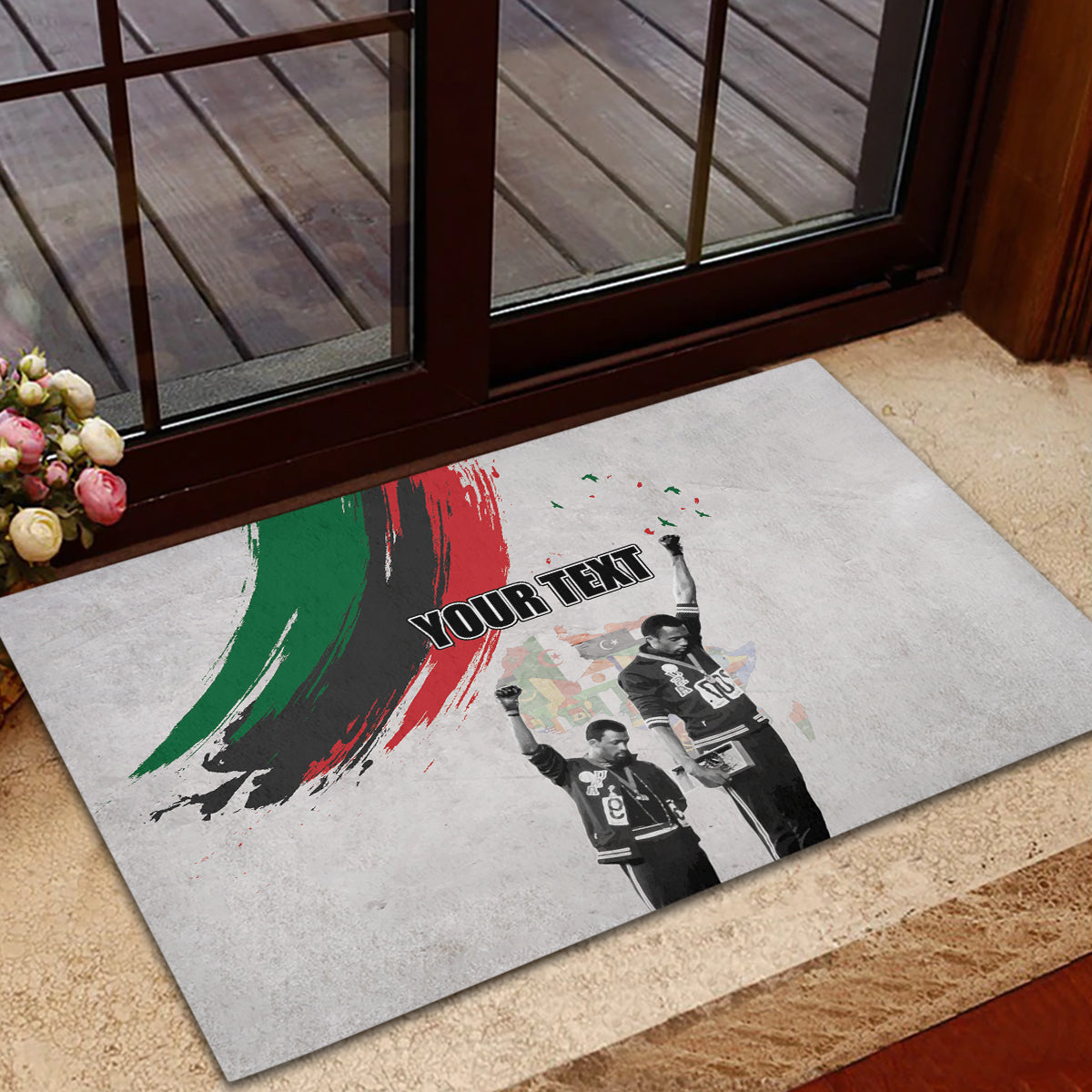 Gray rubber doormat with black trim, green-red brush salute and 'YOUR TEXT' center