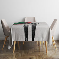 Personalized Juneteenth tablecloth on table with centered black-and-white figure print and green/red accents