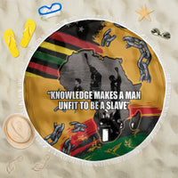 Round beach blanket, yellow with black/red/green graphic and white fringe edge