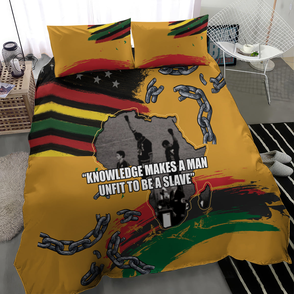 Yellow duvet cover with two pillowcases, chains and handcuffs over black-and-rainbow stripes
