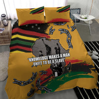 Yellow duvet cover with two pillowcases, chains and handcuffs over black-and-rainbow stripes