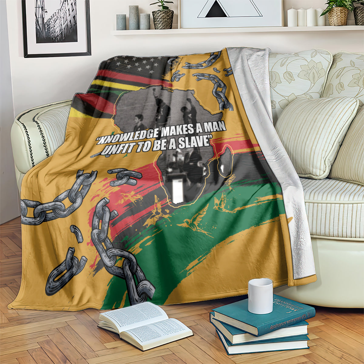 Juneteenth Freedom Day blanket draped on sofa, yellow with chains, map, and slogan