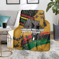 Juneteenth Freedom Day blanket on floor, yellow with chains, African map, and slogan