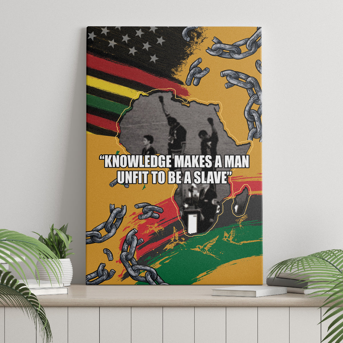 Canvas wall art with broken chains and black silhouette over red-yellow-green flag rays