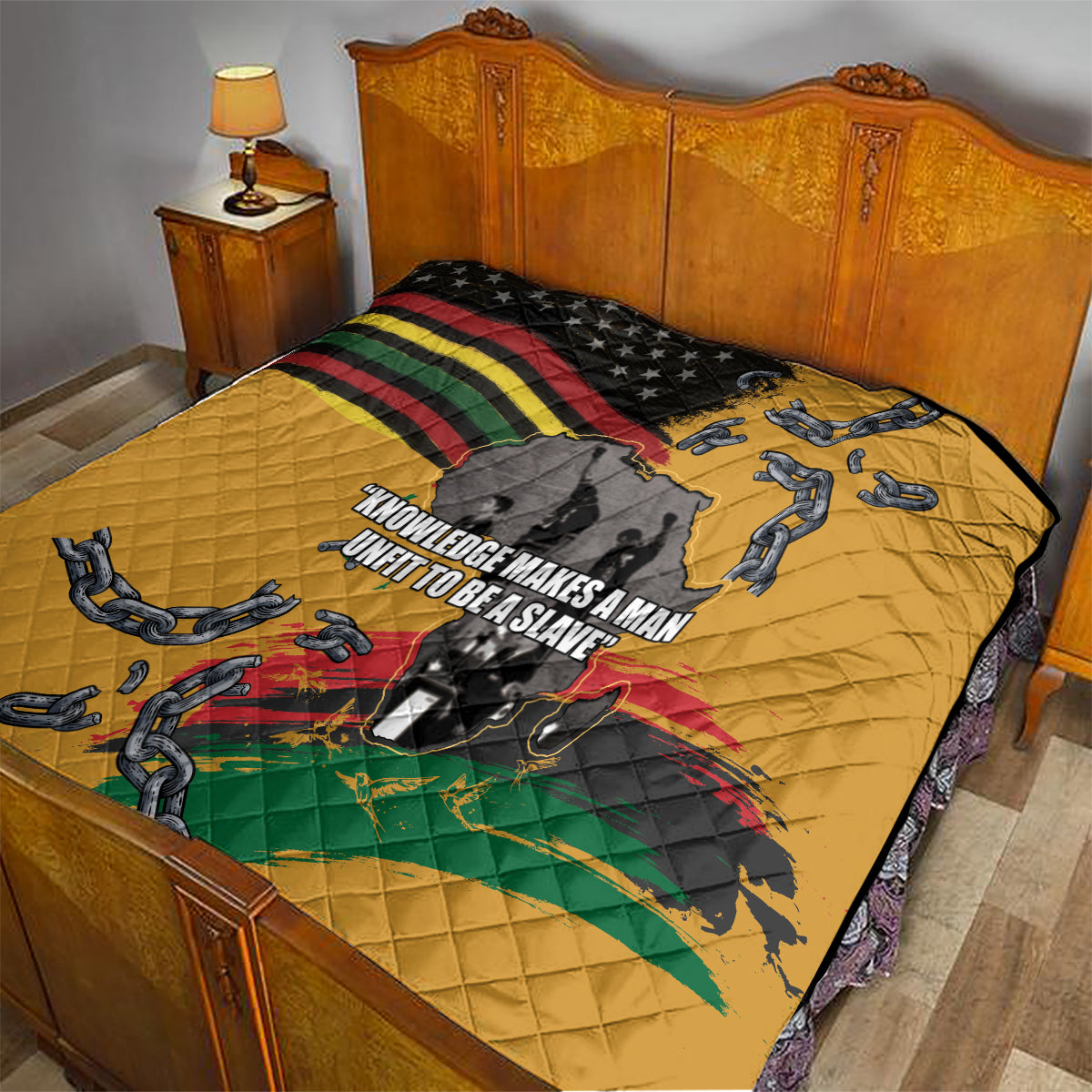 Yellow quilt on bed with black star section, rainbow stripes, chain graphics, and map artwork.
