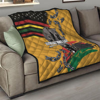 Yellow quilt draped on sofa with black star corner, rainbow stripes, chain motifs, and map.