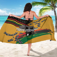 Yellow printed sarong with chain links and star stripe graphic, worn open