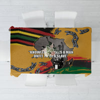 Yellow tablecloth with black, red, green graphic chain and fist design
