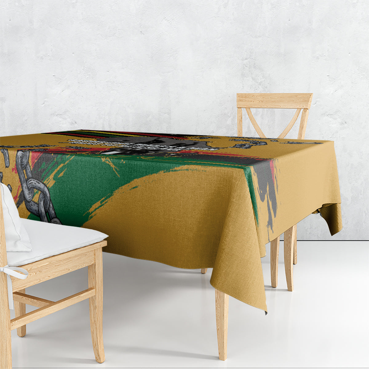 Yellow tablecloth with graphic chain motif and rainbow stripe pattern on table edge