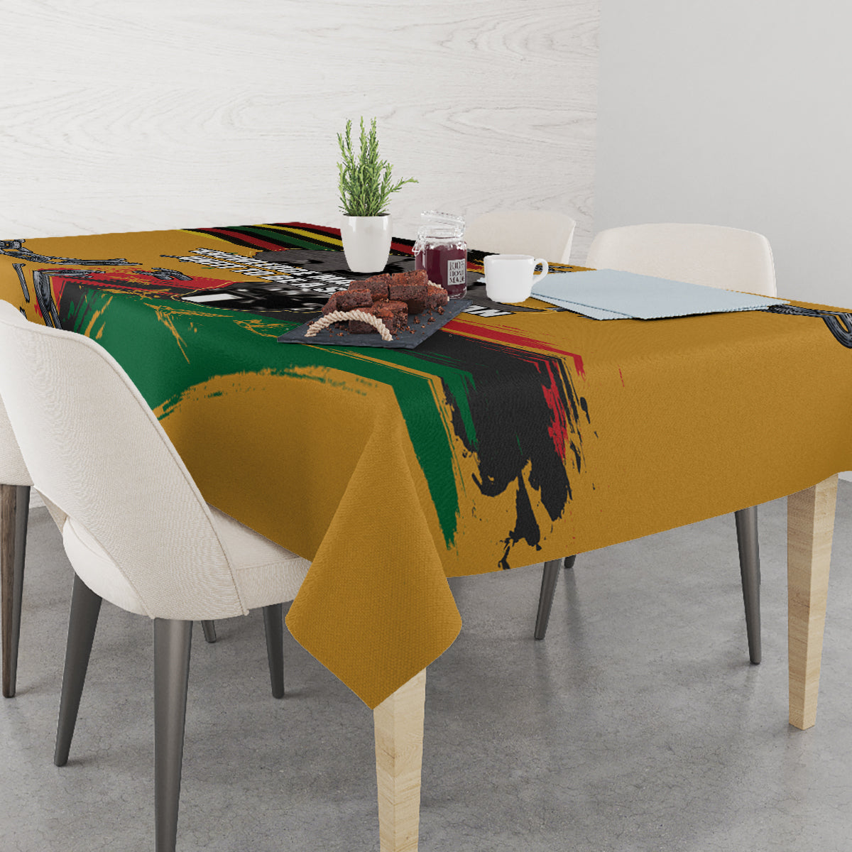 Yellow tablecloth with chain and fist print draped over dining table corners