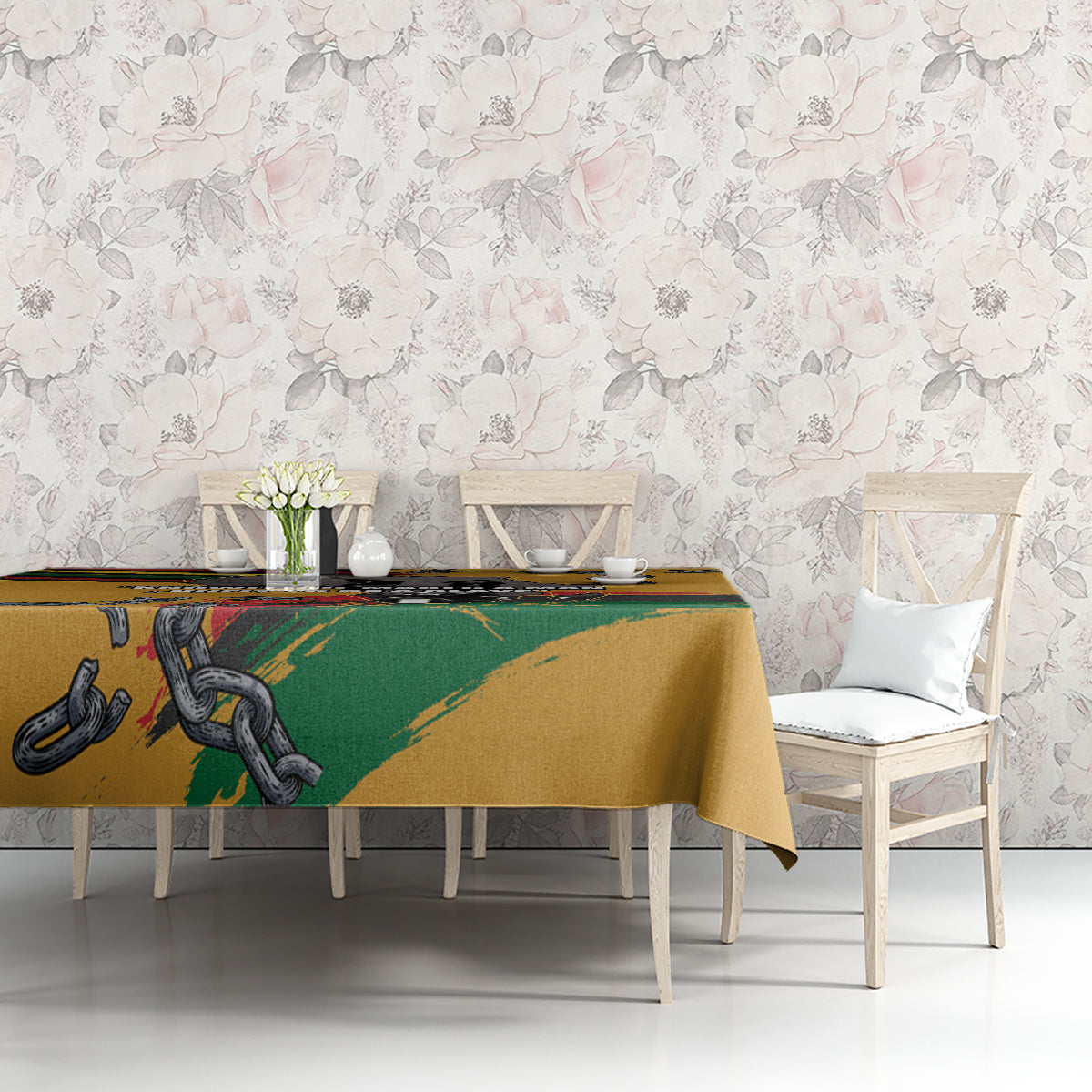 Yellow tablecloth with chain and fist graphic across the table, front view