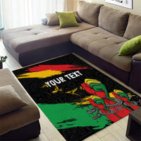 Black corner view area rug with raised fist graphic and red yellow green stripe bands