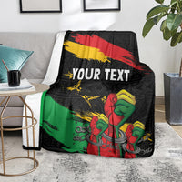 Black personalized blanket with 'YOUR TEXT' raised-fist design and red-yellow-green stripes
