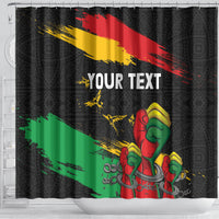 Black shower curtain with raised fists graphic on red-yellow-green diagonal stripes, “YOUR TEXT”