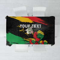 Personalized black tablecloth with raised fist and Africa-inspired graphic, with 'YOUR TEXT'.