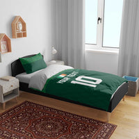 Green duvet with 'YOUR TEXT' and large '10' print, shown on a bed with two pillows
