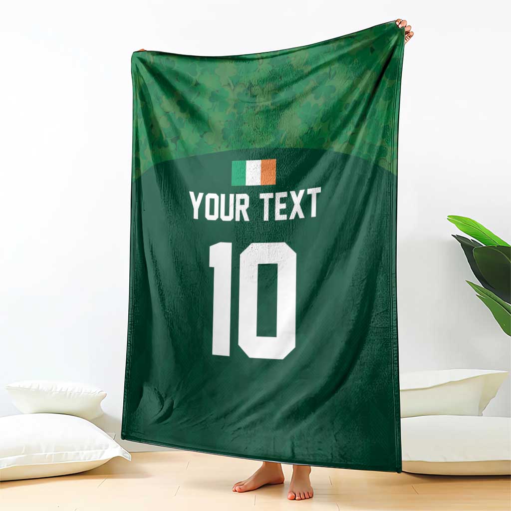 Green rugby-style blanket draped upright, showing 'YOUR TEXT' and white '10'