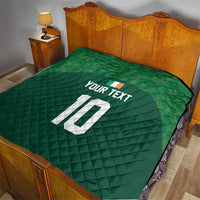 Green bed quilt with diamond stitching, custom text and number 10 in white