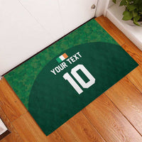 Green rubber doormat with arched emblem, placeholder text and number 10