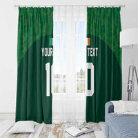 Green rugby-themed window curtain pair with custom text and white number 10, front view in bedroom