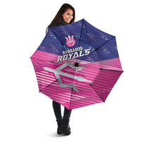 Open pink and navy umbrella with Barbados Royals crest and trident symbol