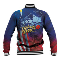Blue baseball jacket, striped ribbed hem and cuffs, back Veterans Day graphic with stars and stripes