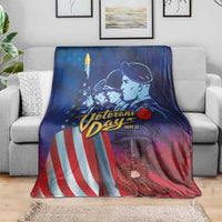 Blue honor blanket with soldiers and stars, spread over gray couch for lounging