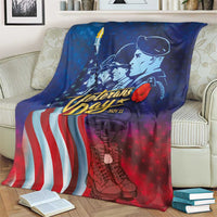 Blue honor blanket with soldier portrait, draped over cream sofa beside books