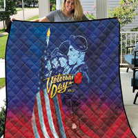 Blue quilt laid flat outdoors featuring Veterans Day soldier, stars and striped flag