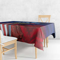 Patriotic tablecloth draped on table: red and blue with flag stripes and soldier print
