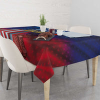 Patriotic tablecloth spread on dining table with red star pattern and flag stripe section