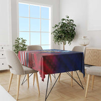 Patriotic tablecloth covering dining table with red-blue gradient stars and striped flag