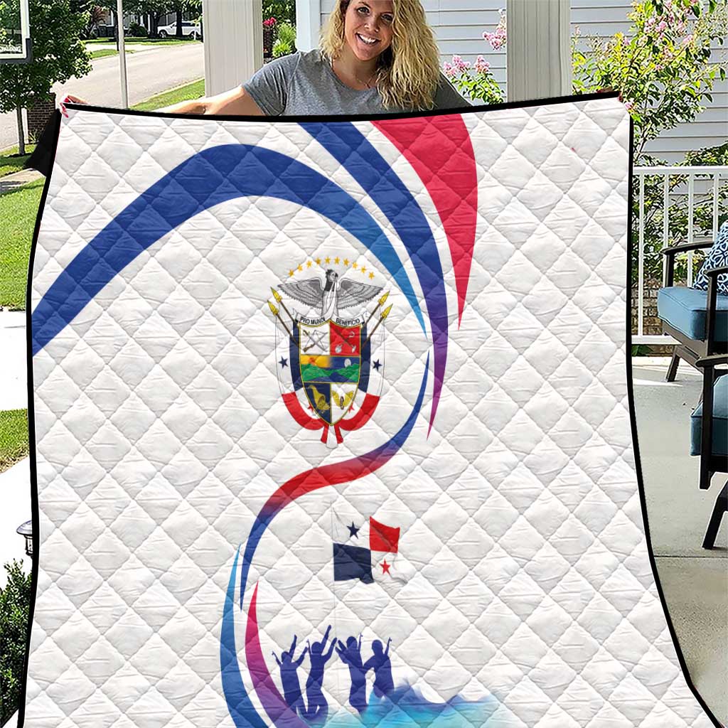 White quilt blanket with quilted texture and Panama crest in center, blue and red arcs